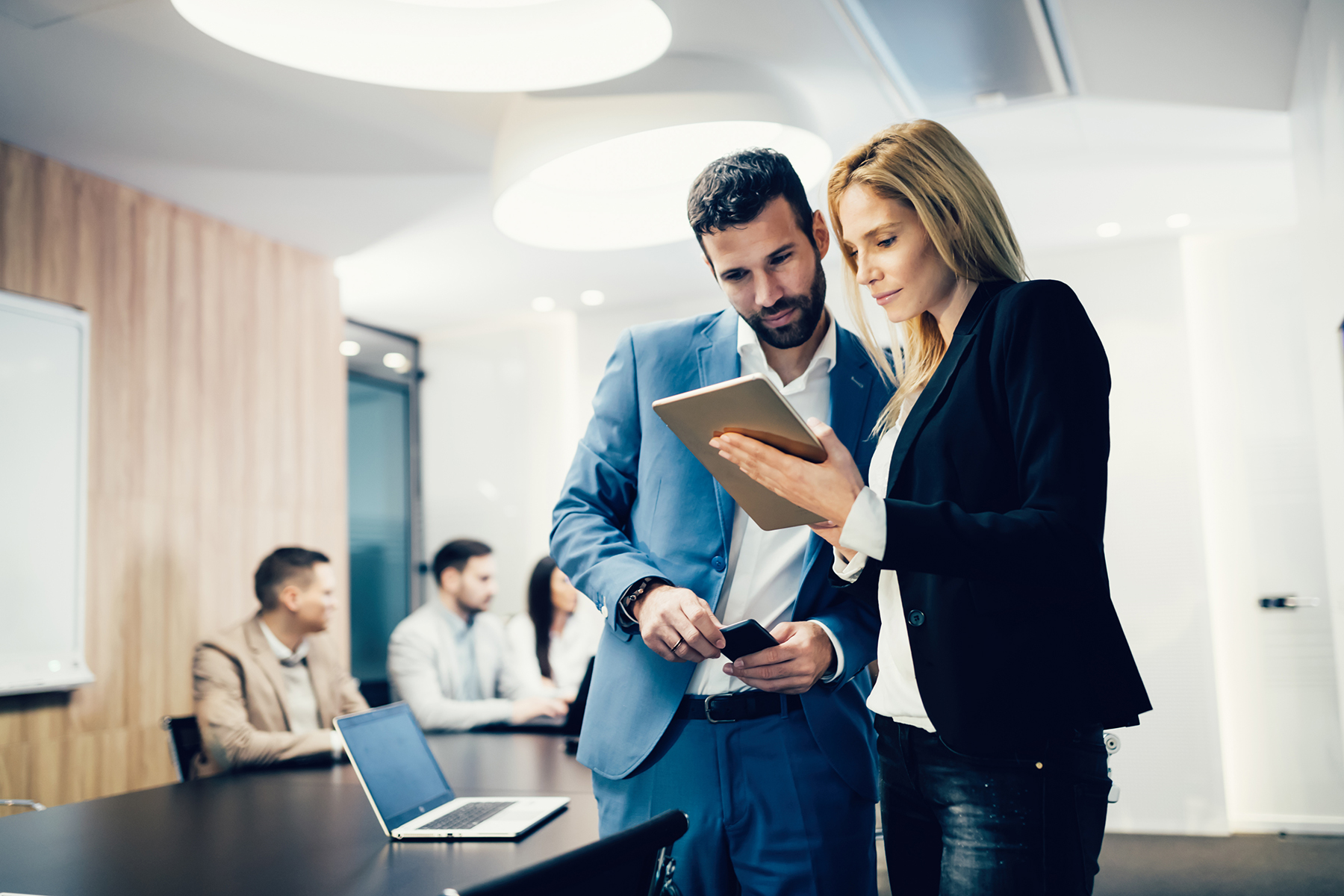 Business colleagues having meeting in conference room in modern office